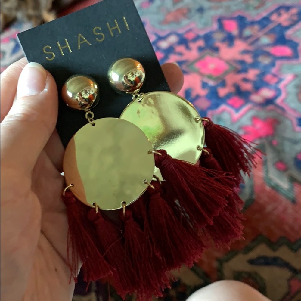 Shashi statement tassel earrings. Burgundy/gold